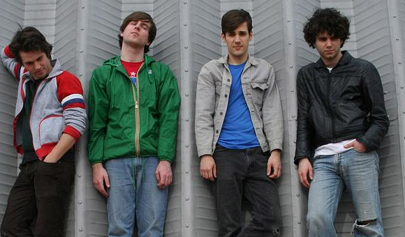 The Danks pose against a wall